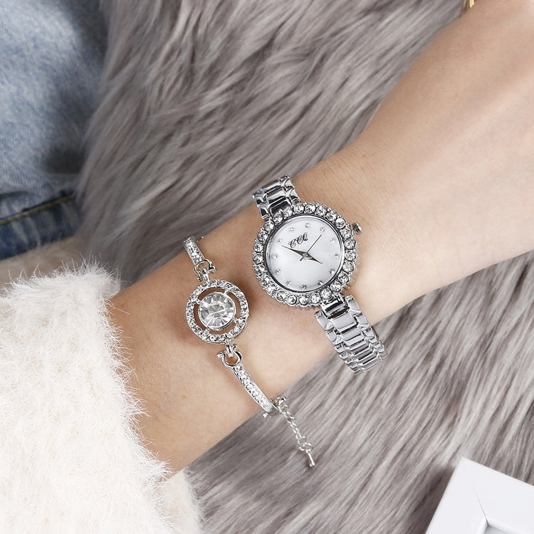 a woman wearing a watch and bracelets