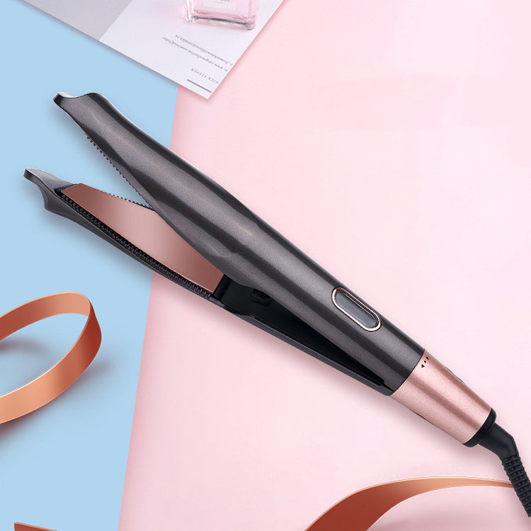 a flat iron with a pink and blue ribbon