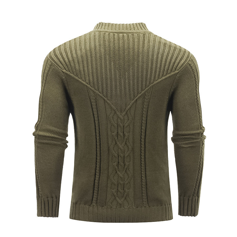 a green sweater with a braided pattern