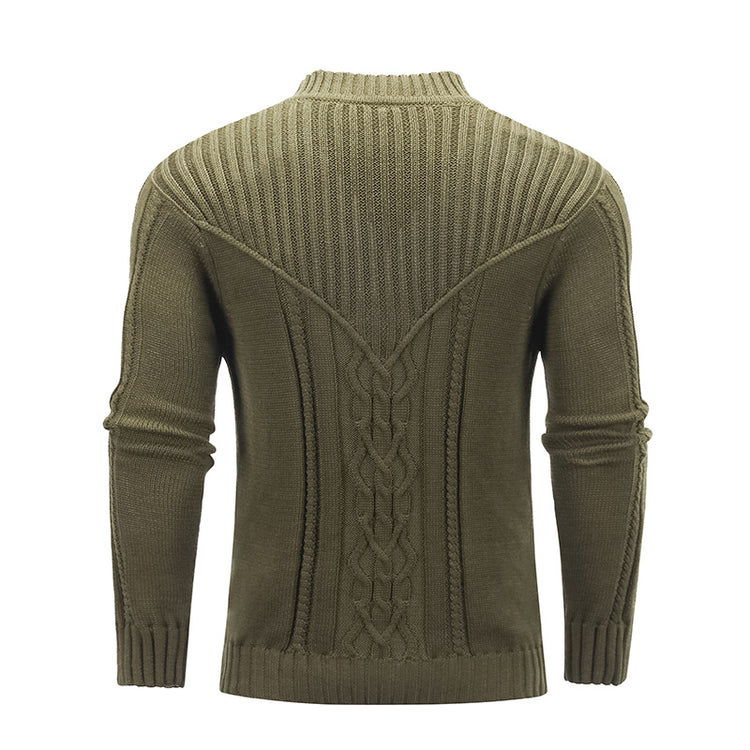 a green sweater with a braided pattern