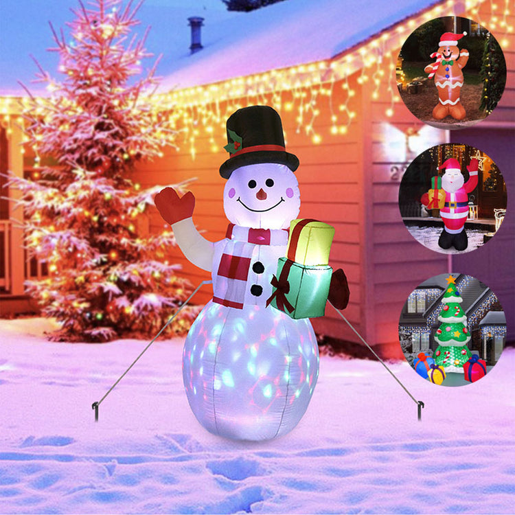 a snowman in front of a house with lights