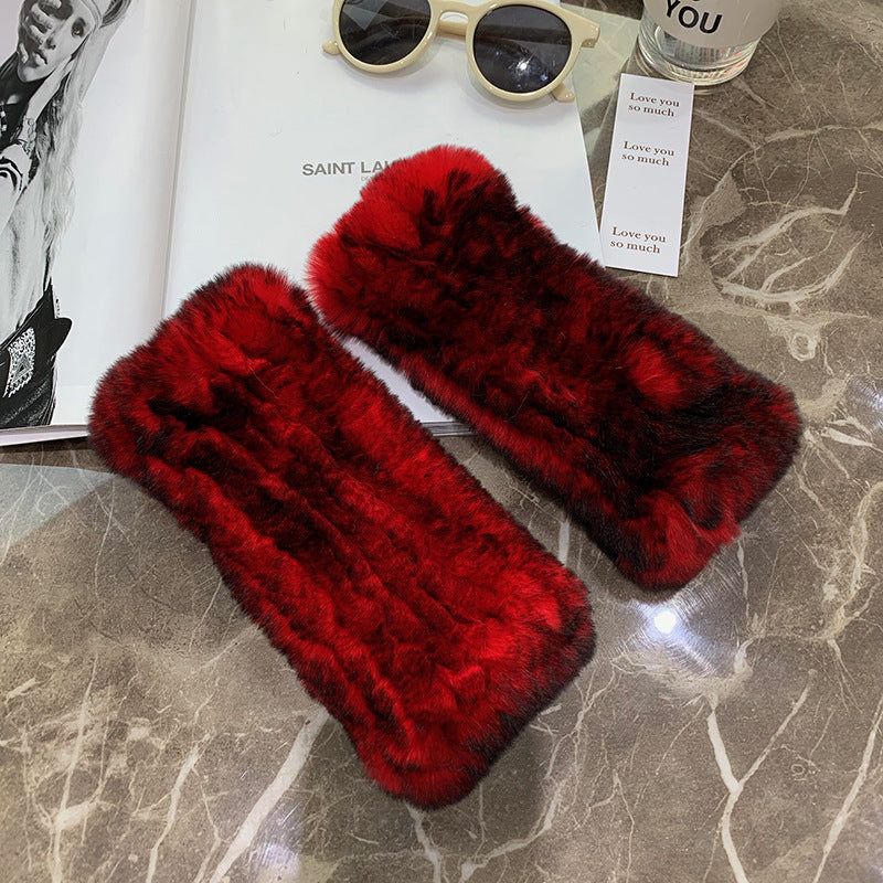 a pair of red fur cases on a marble surface