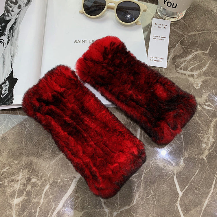 a pair of red fur cases on a marble surface