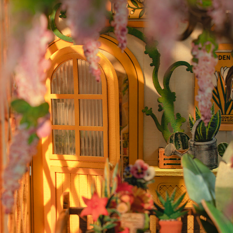 a yellow house with flowers from the ceiling