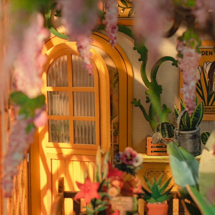 a yellow house with flowers from the ceiling