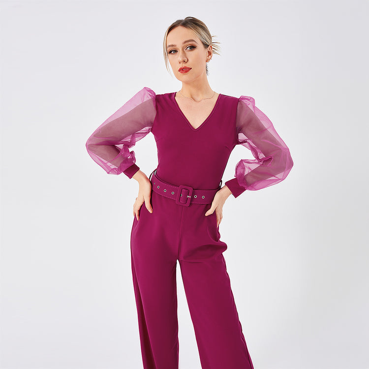 a woman in a purple jumpsuit