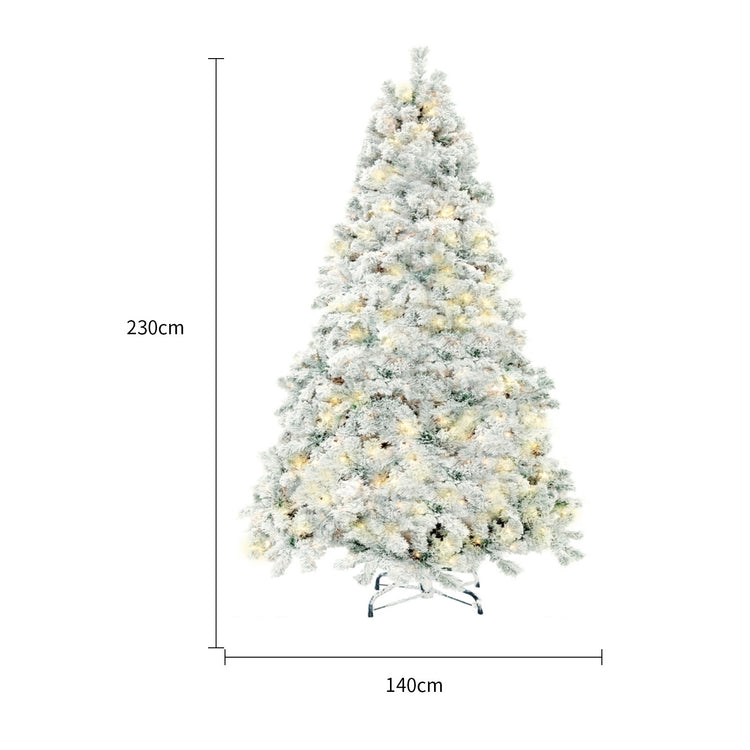 a tall christmas tree with lights