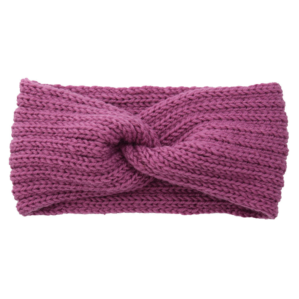 a purple knit headband with a knot