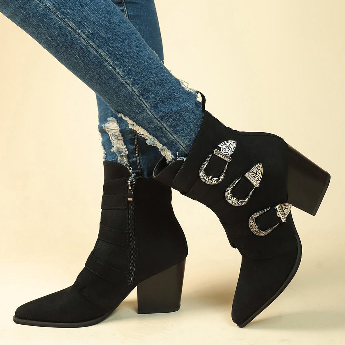 a person wearing jeans and black boots