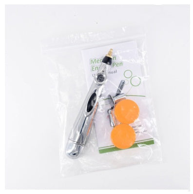 a pen and a bag of orange buttons