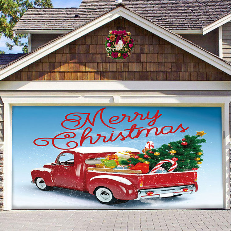a garage door with a red truck and a christmas tree