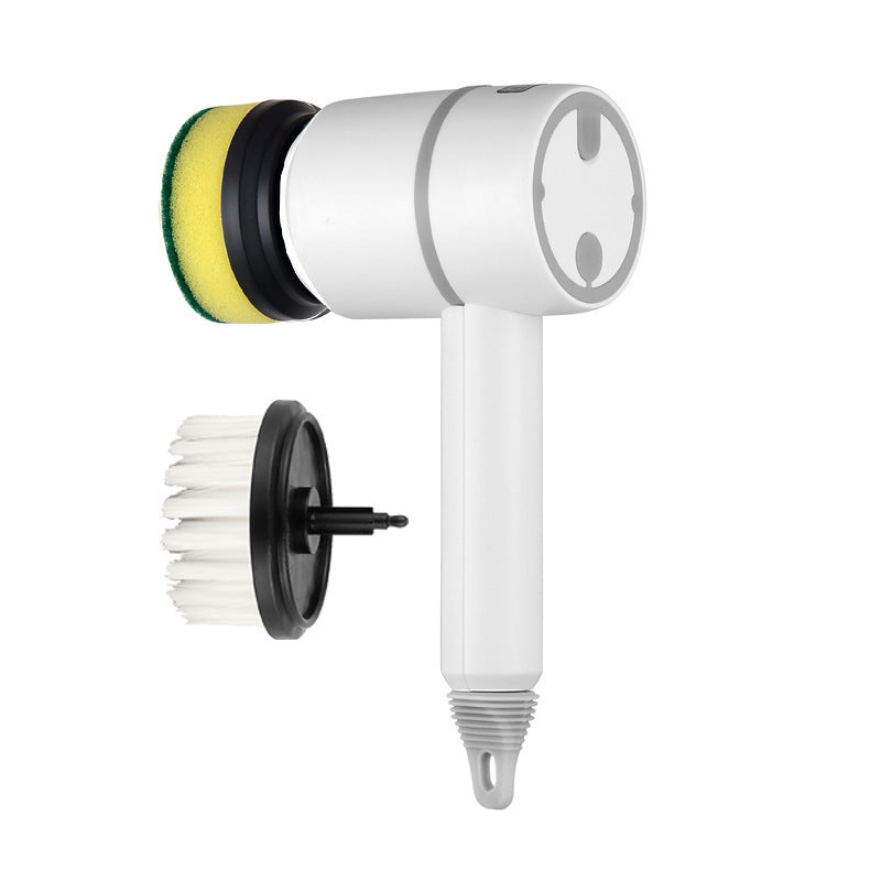 a white circular object with a yellow sponge and a black round brush