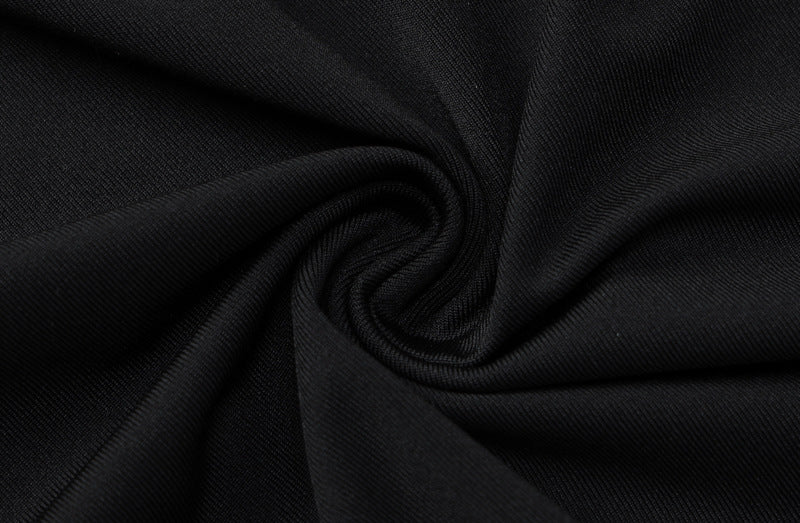 a black fabric with a spiral pattern