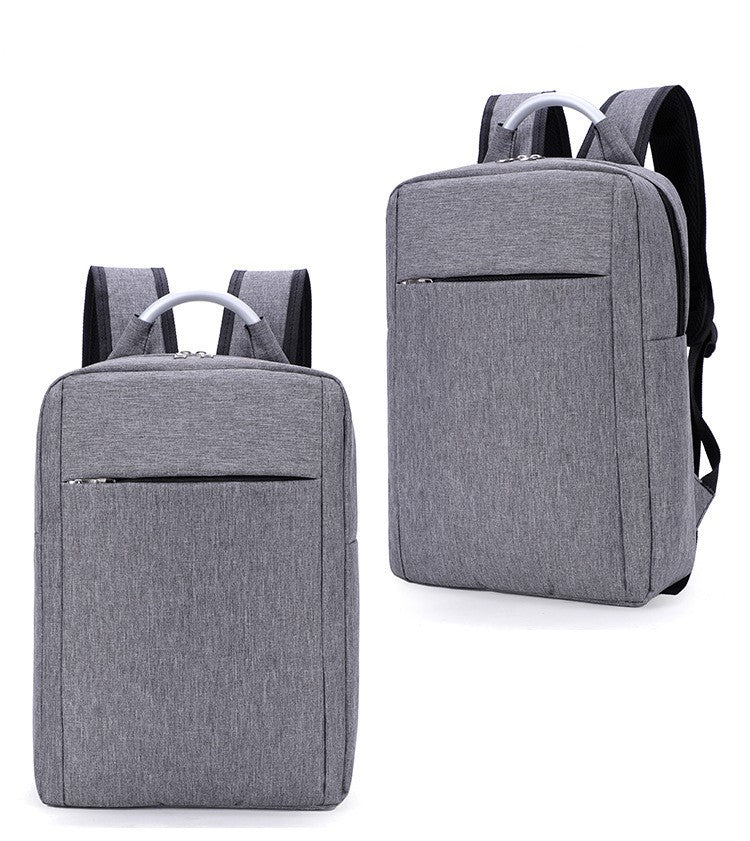 a pair of grey backpacks