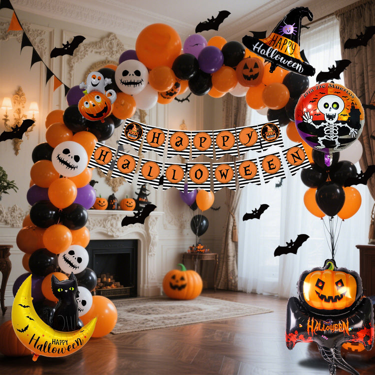 a halloween balloon arch with a banner and pumpkins