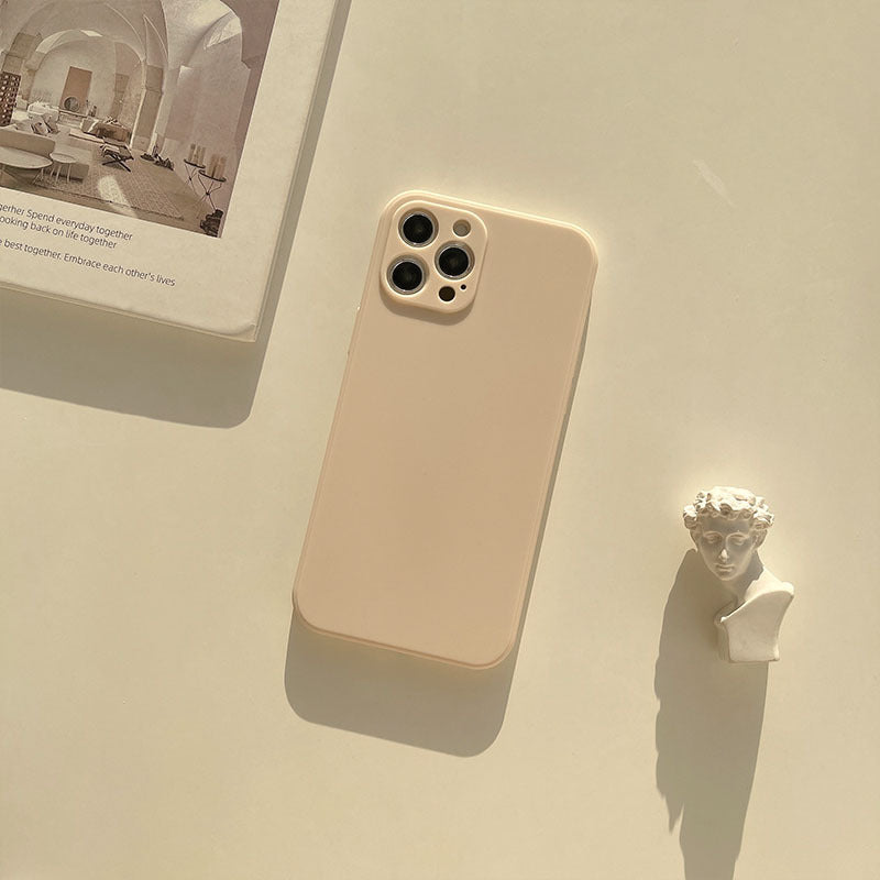 a phone and a statue on a table