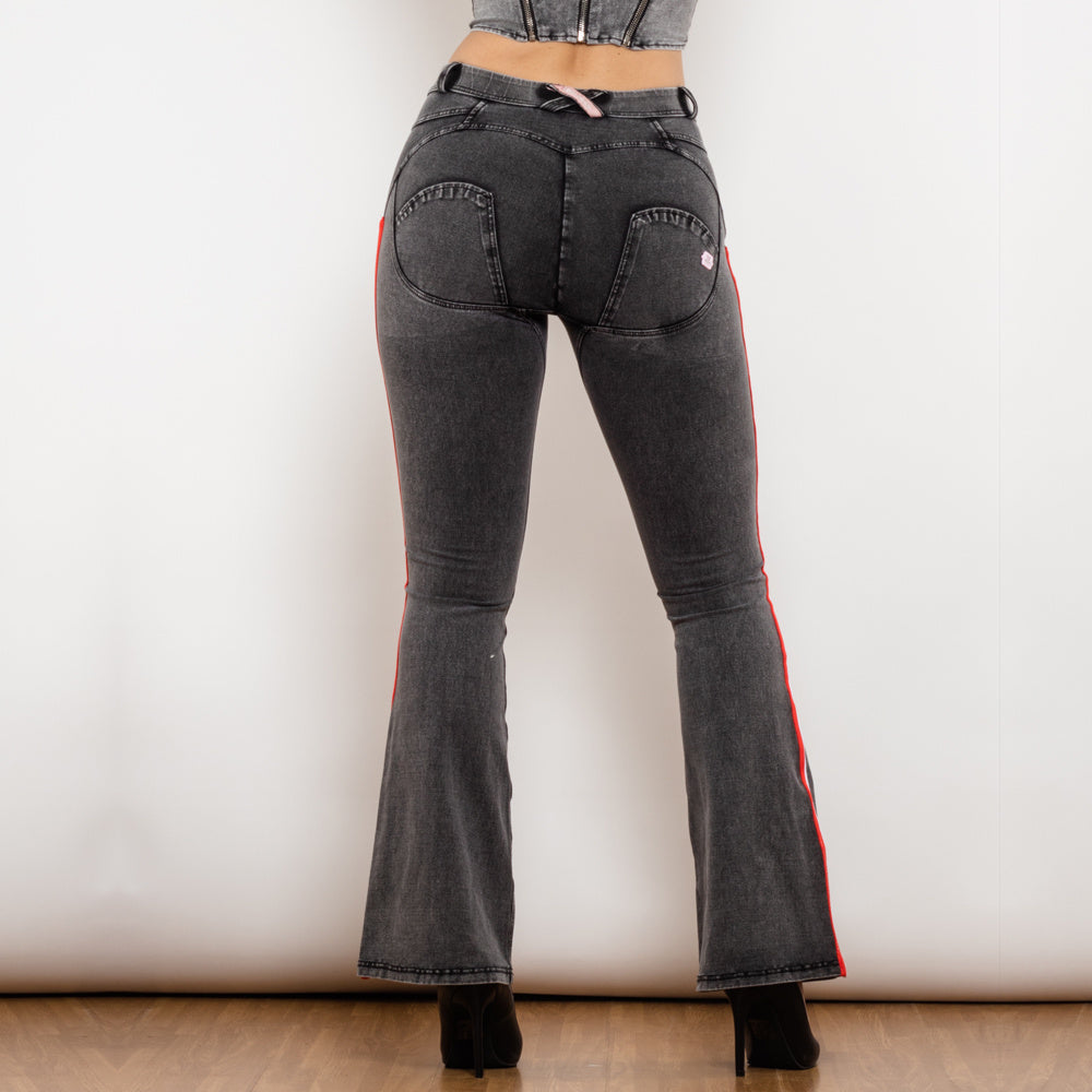 a woman wearing jeans and a crop top