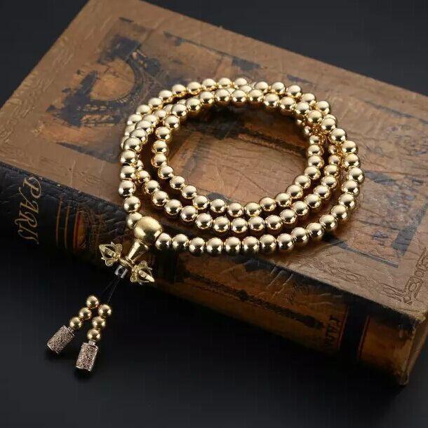 a gold necklace on a book