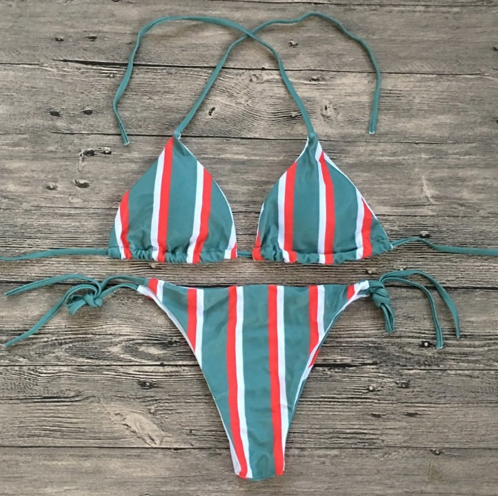 a striped garment on a wood surface