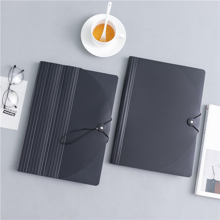 a pair of folders with a string tied around the top