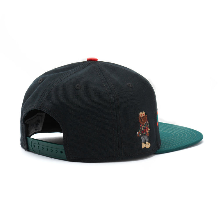 a black hat with a bear on it