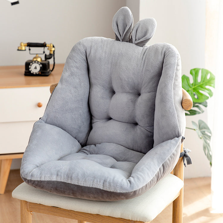 a grey chair with bunny ears on it