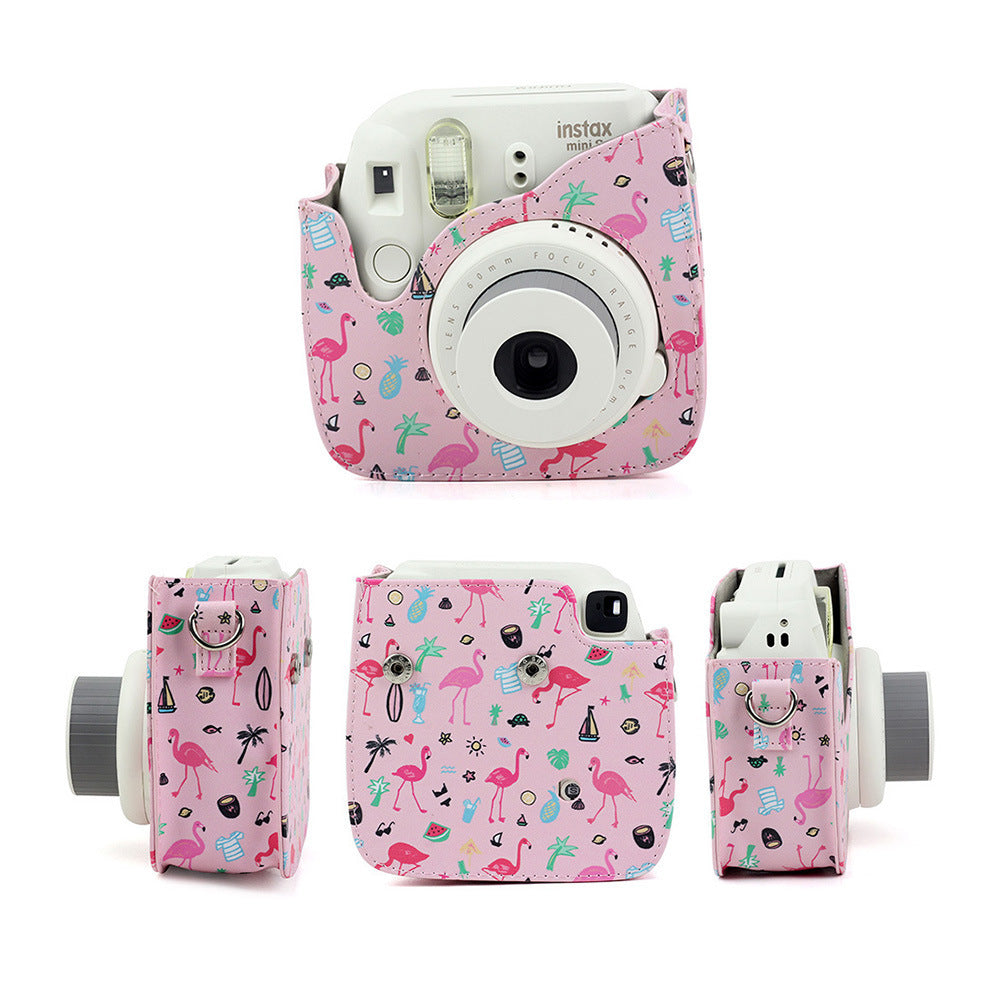 a camera with a pink cover