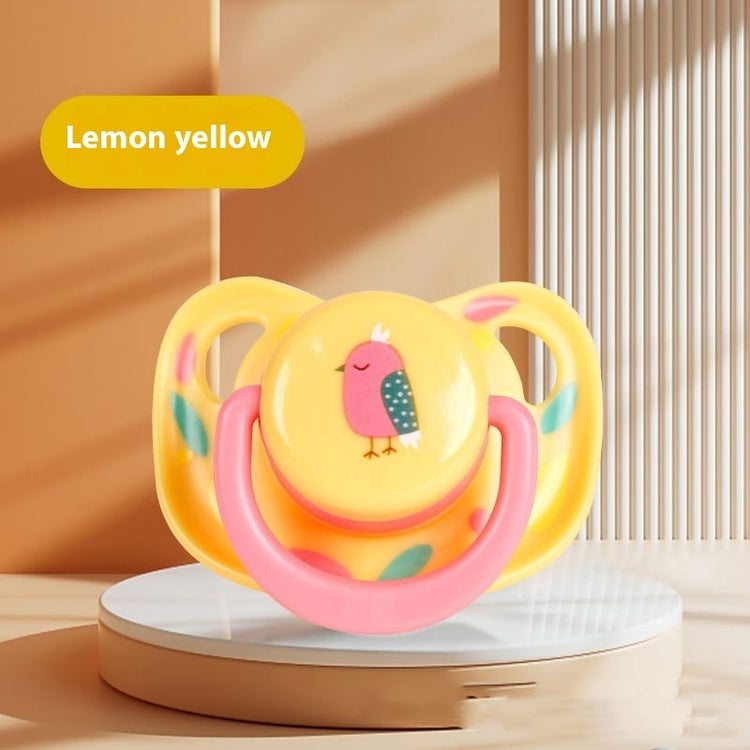 a yellow pacifier with a bird on it