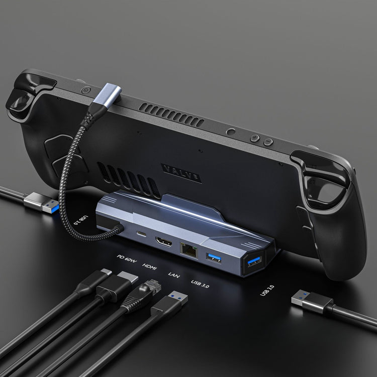 a black gaming console with cables