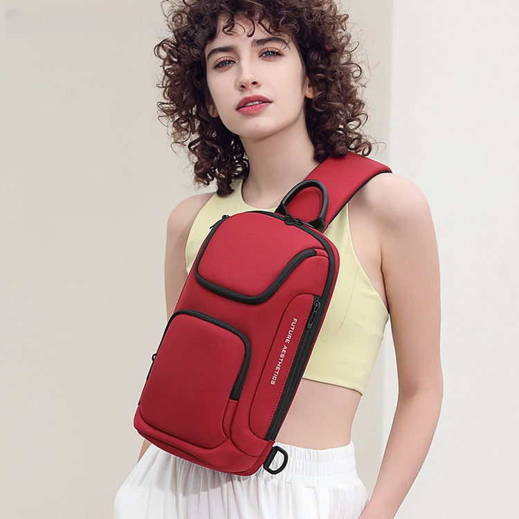 a woman with curly hair holding a red backpack