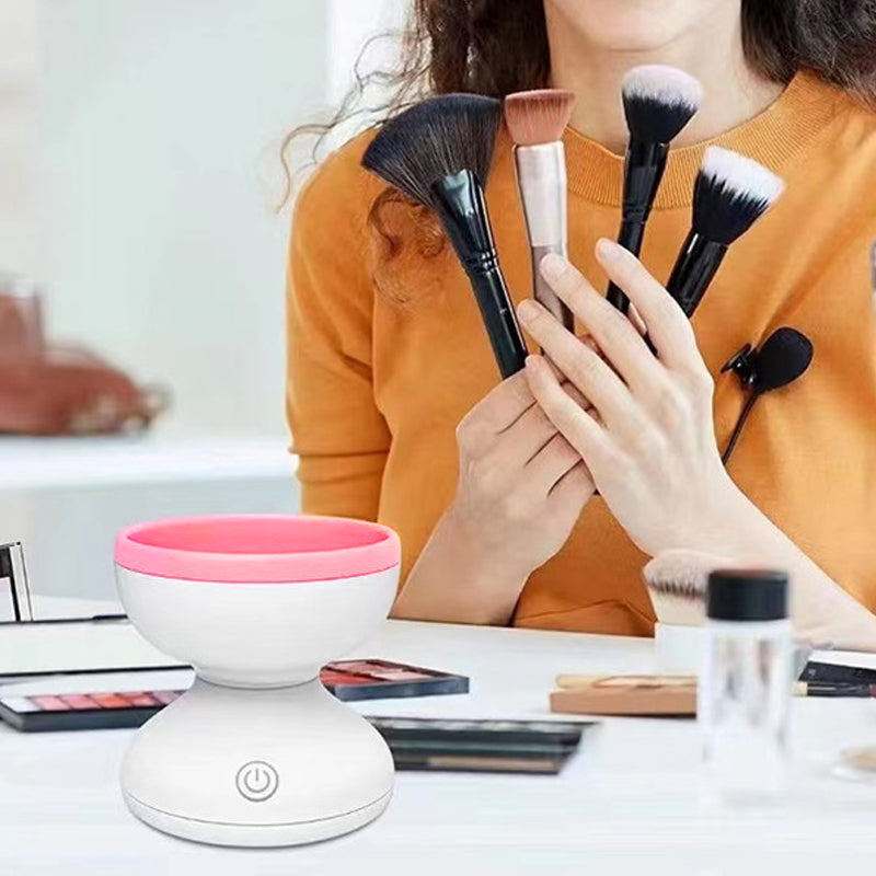 a woman holding a group of brushes