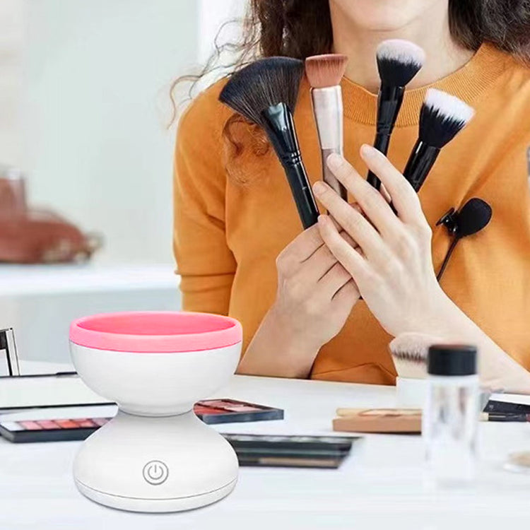 a woman holding a group of brushes