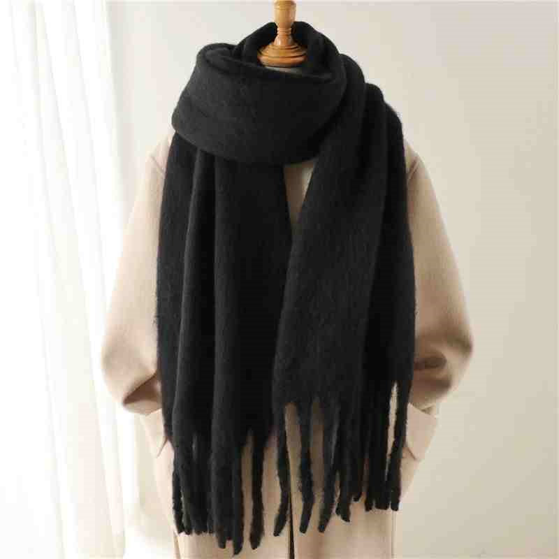 a black scarf on a mannequin