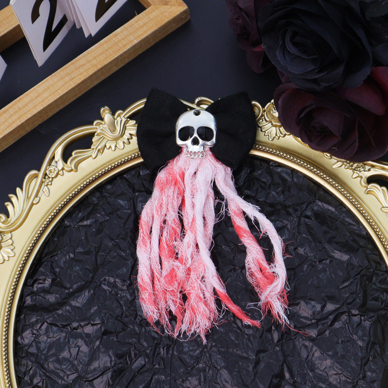 a gold frame with a skull hair clip and flowers
