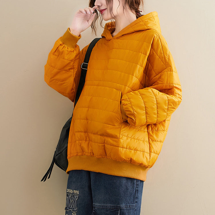 a woman in a yellow jacket