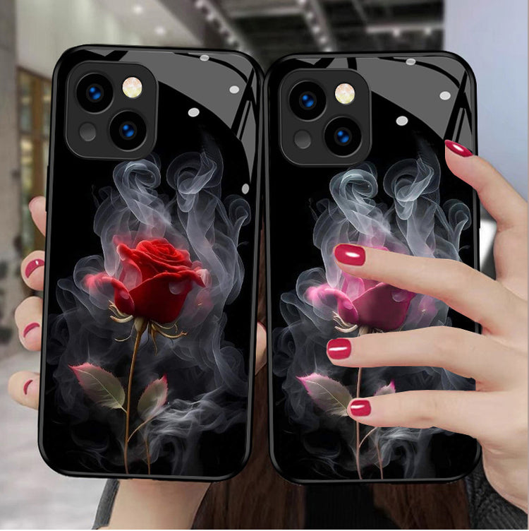 a couple of cell phones with roses and smoke