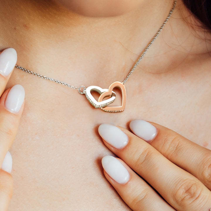 a woman with long nails touching her neck