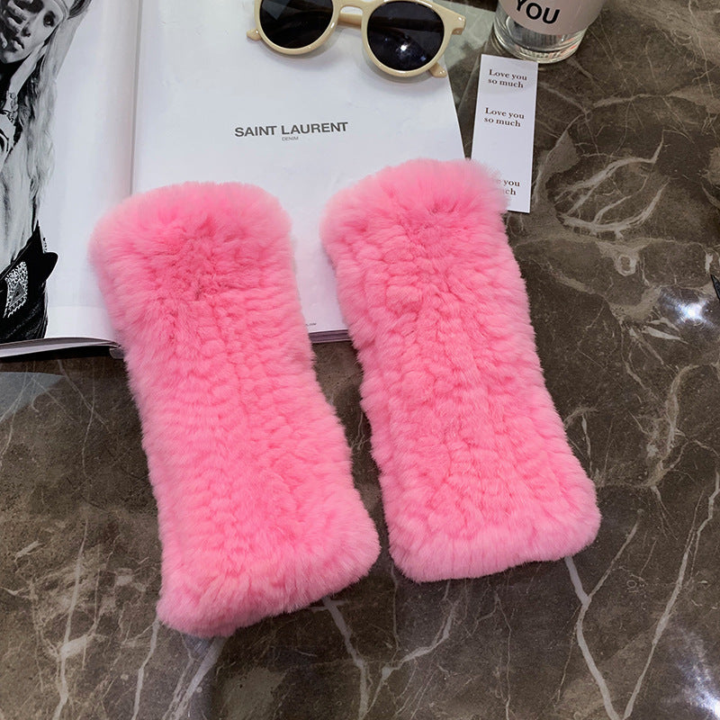 a pair of pink fur on a marble surface