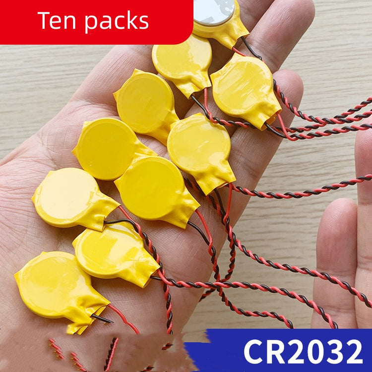 a hand holding yellow round objects