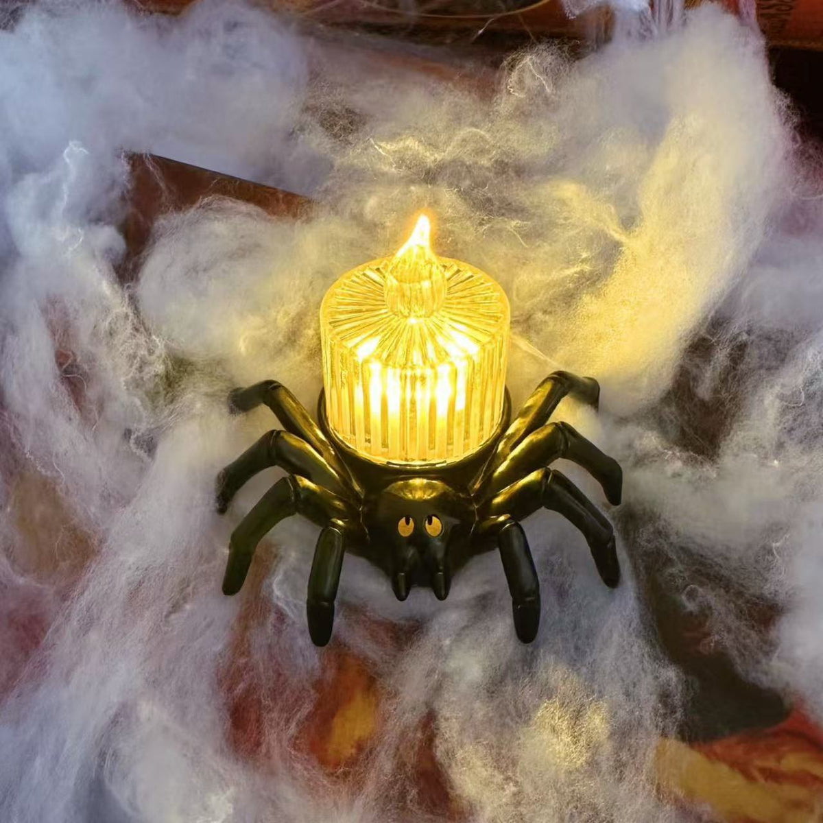 a spider shaped light on a spider web