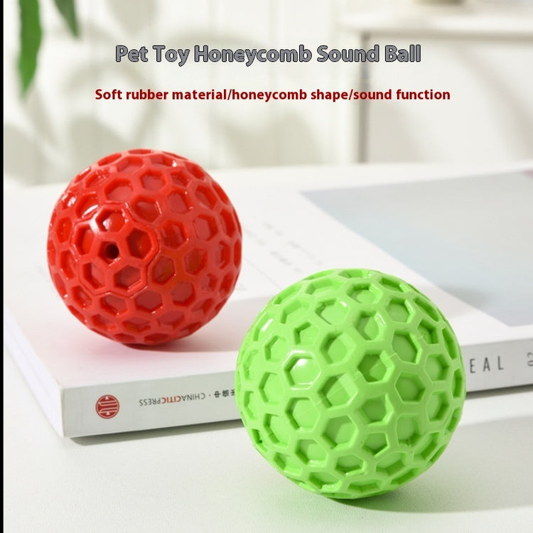 a red and green ball on a book