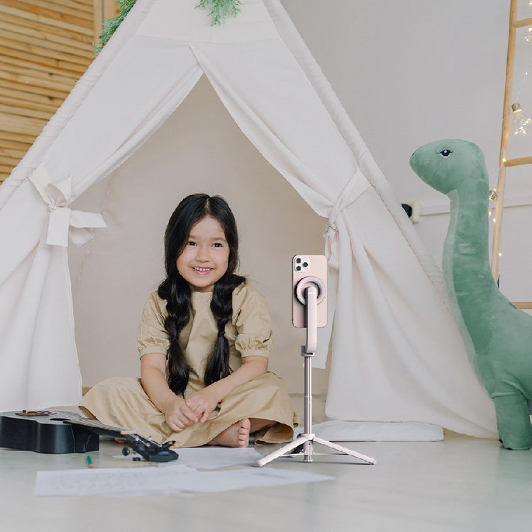 a girl sitting in a tent