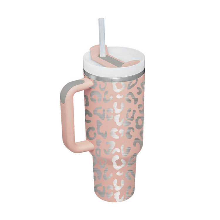 a pink and silver tumbler with a straw