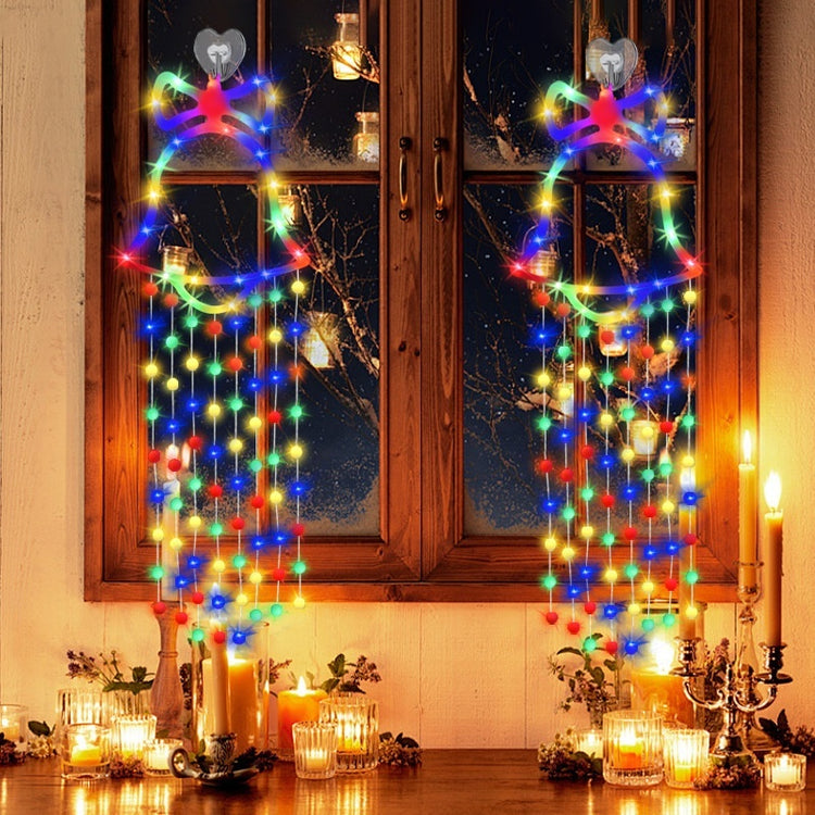 a window with lights and candles