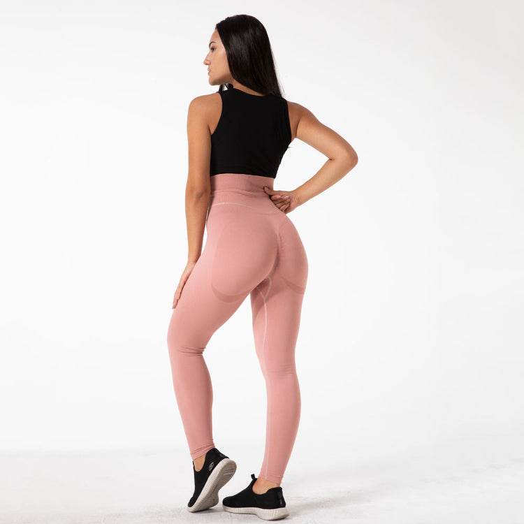a woman in pink leggings