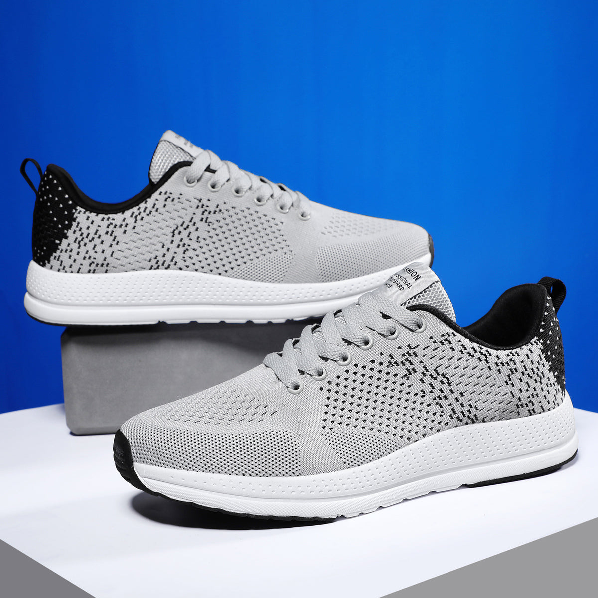 a pair of grey and black sneakers