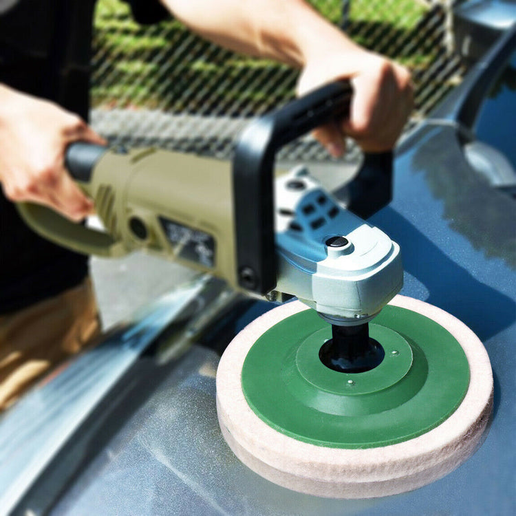 a person using a machine to polish a car