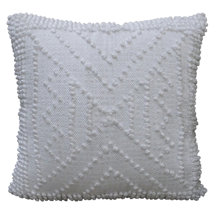 a white pillow with a x design