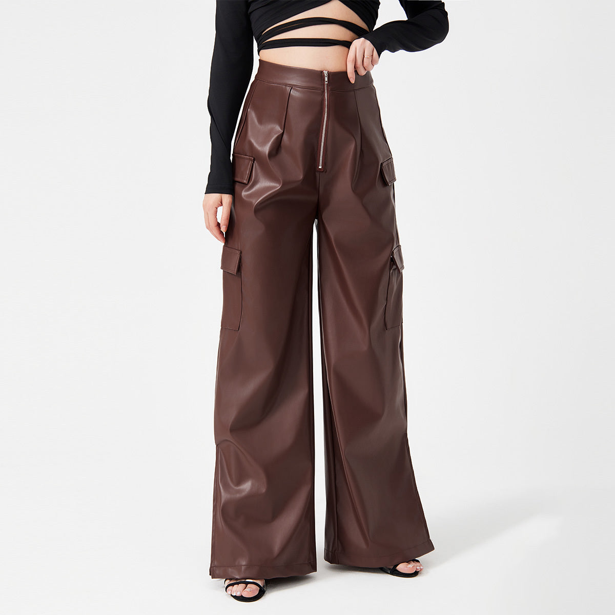 a woman wearing a black shirt and brown pants