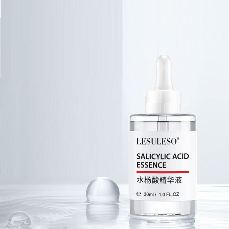 a bottle of liquid with a dropper